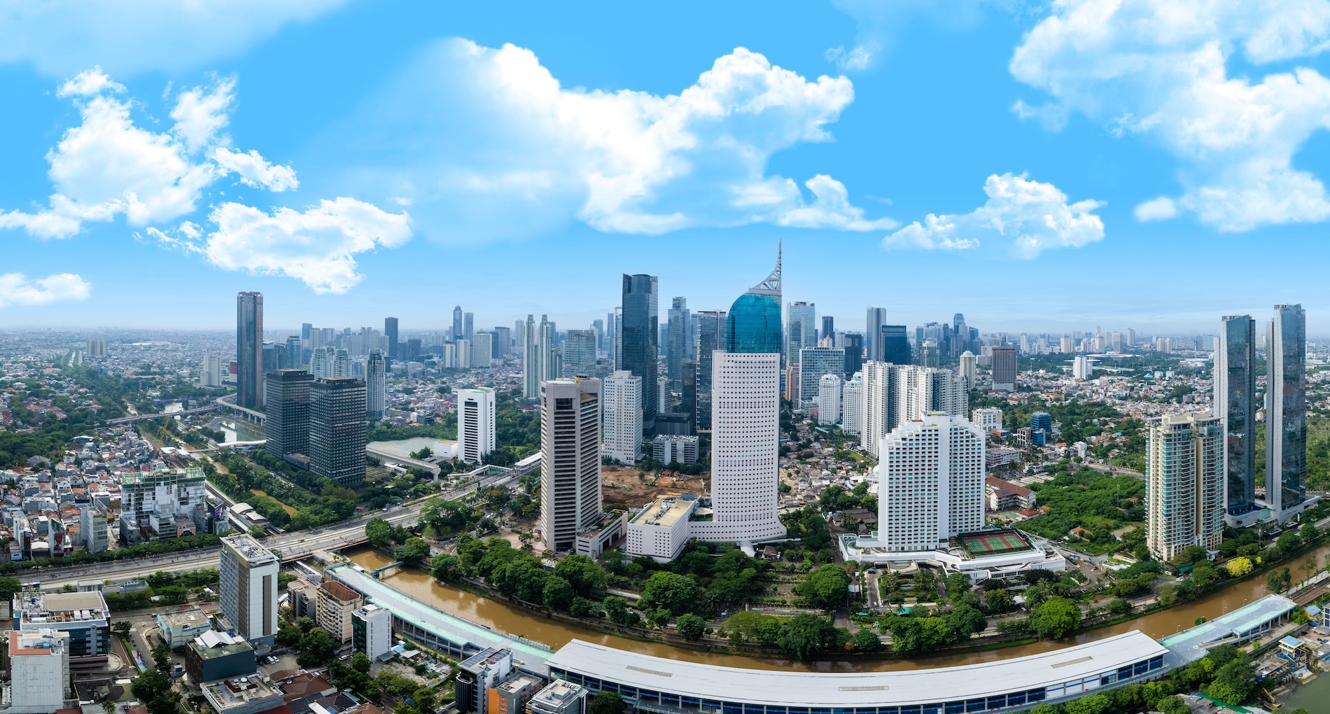 Skyline of Jakarta featuring many high-rise buildings.