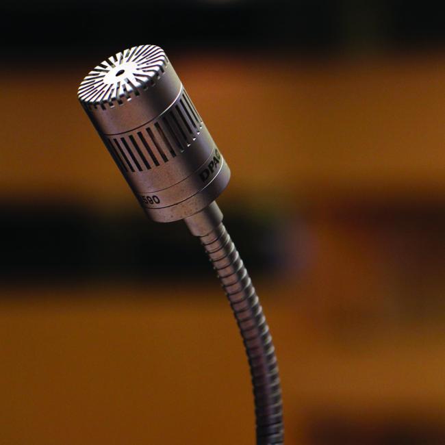A an older looking metal microphone