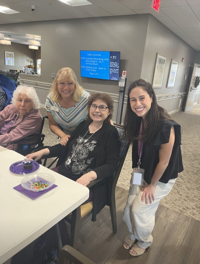 Emma with seniors at Dove Hospice 
