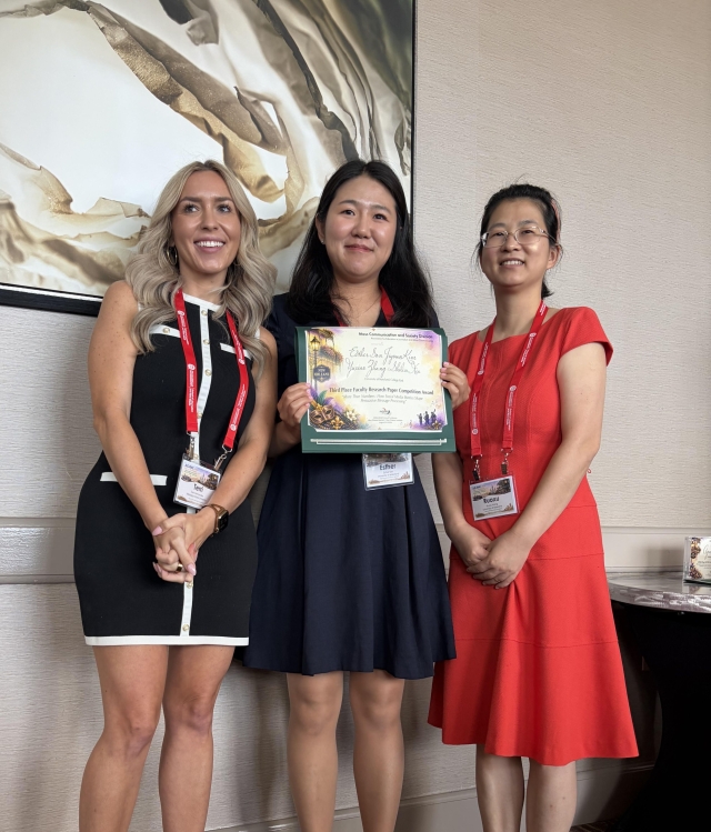 Esther Son with Award at AEJMC